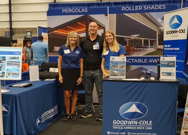 Goodwin-Cole team members at their booth during a home show